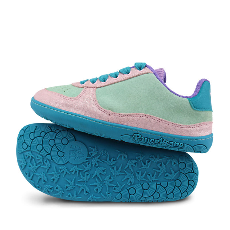 Pair of PaperKrane Adults Low Shoes - Minty, one balanced on top of the other. One showing the outer side view and the other showing the sole view.
