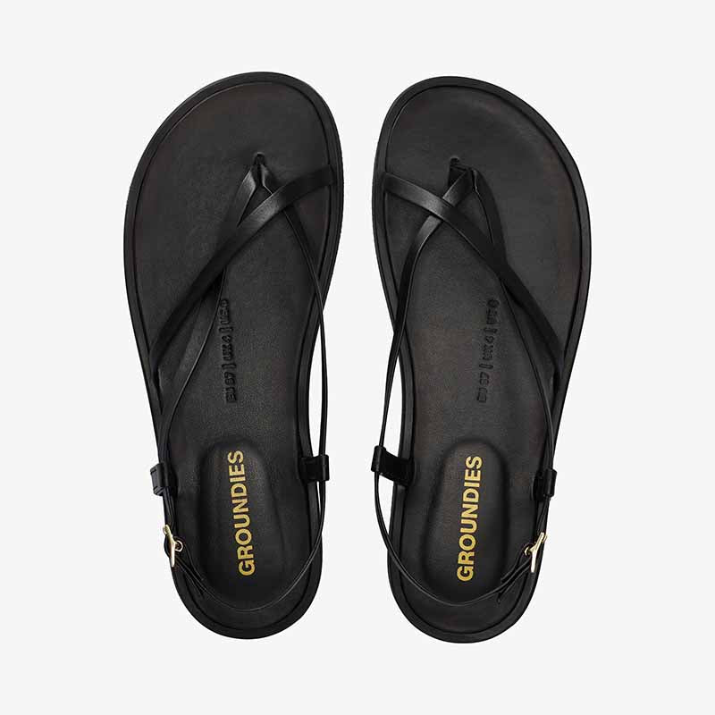 Pair of Groundies Adults Maya Sandals - Black, top view.