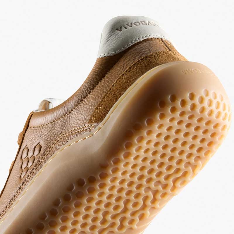 Vivobarefoot Men's Gobi II Leather Trainers - Tan, angled view showing the sole and heel.