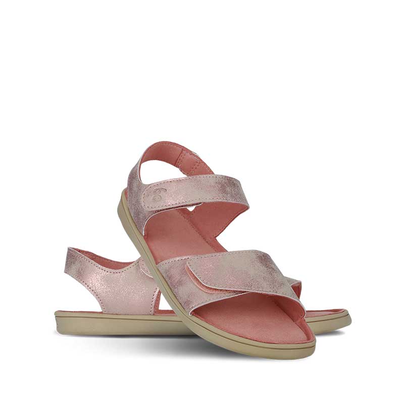 Pair of Be Lenka Kids Sandals Miami - Coral Sparkle, one angled and leaning showing the outer side, the other partially showing the inner side