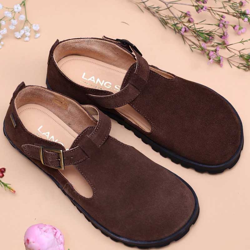 Pair of Tikki Lang.S Women's Shoes Mira - Brown on a beige background with flowers.