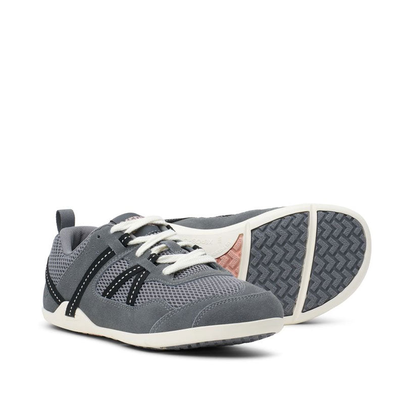 Pair of Xero Women's Athletic Shoes Prio - Grey/Pink Sand, one angled showing the outer side and front view and the other showing the sole view.