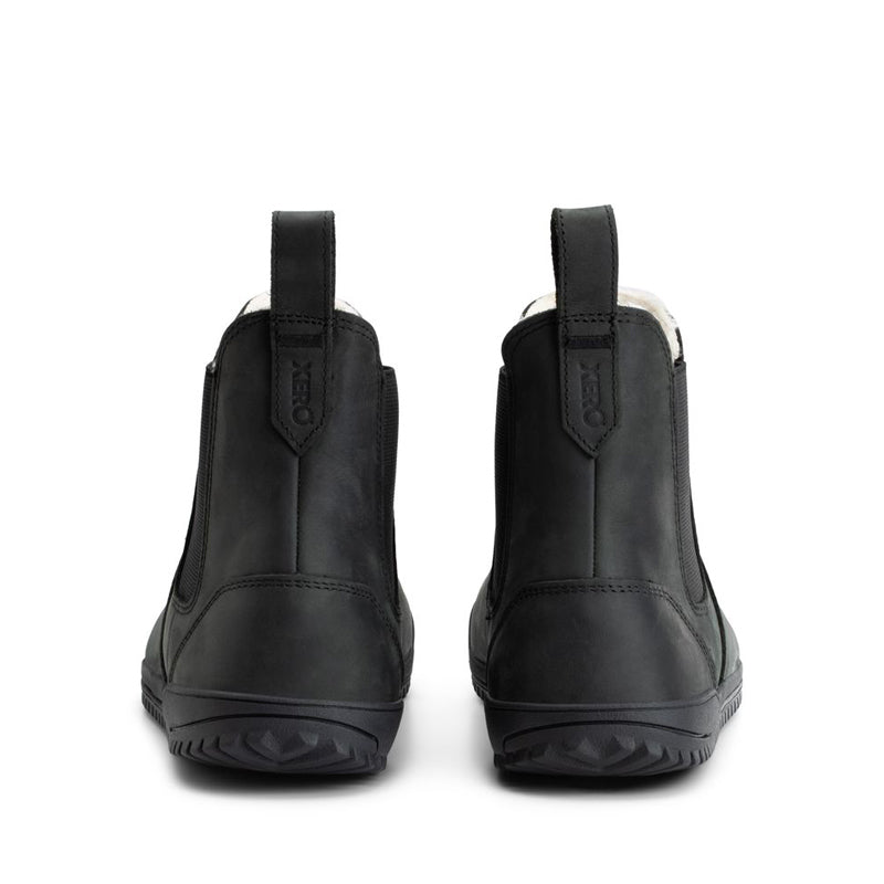 Pair of Xero Women's Lined Chelsea Boots Ridgeway - Black, rear view.
