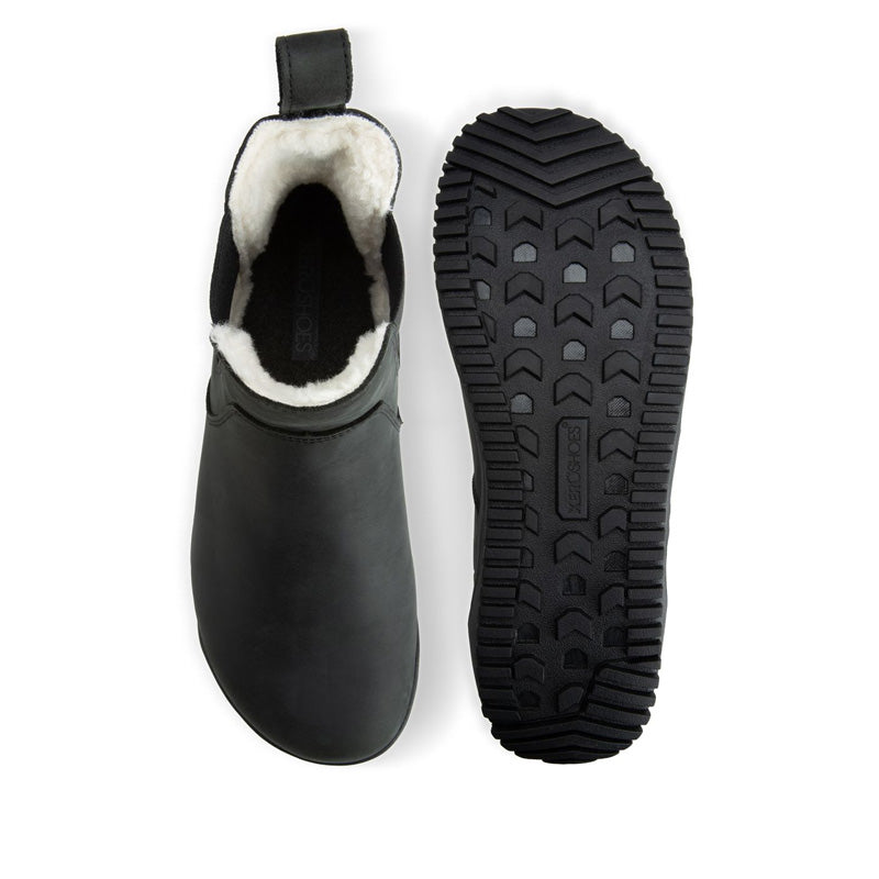 Pair of Xero Women's Lined Chelsea Boots Ridgeway - Black, one showing the top view and the other showing the sole view.