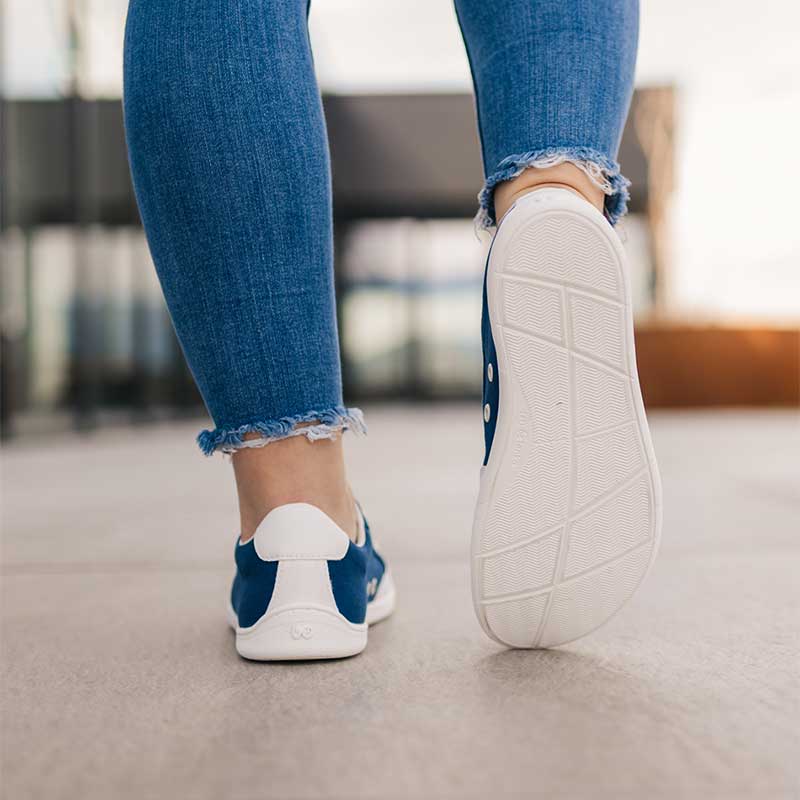 Person wearing Be Lenka Adults Trainers Rebound - Dark Blue and White, rear and sole view
