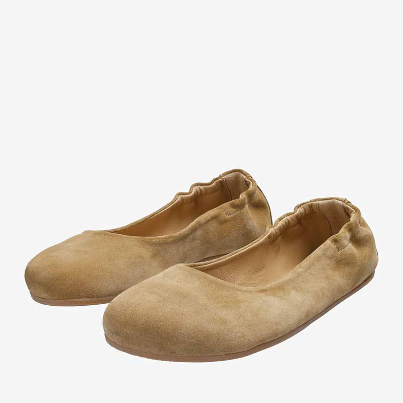 Pair of Groundies Adults Sleek Ballet Shoes - Beige, angled view showing outer side and front.