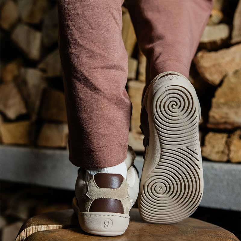Person wearing Shapen Women's Teddy Trainers - Brown.