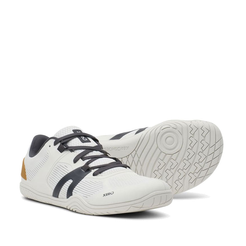 Pair of Xero Men's Trainers 360 Rally - White Asphalt, one angled showing the outer side and front view and the other showing the sole view.