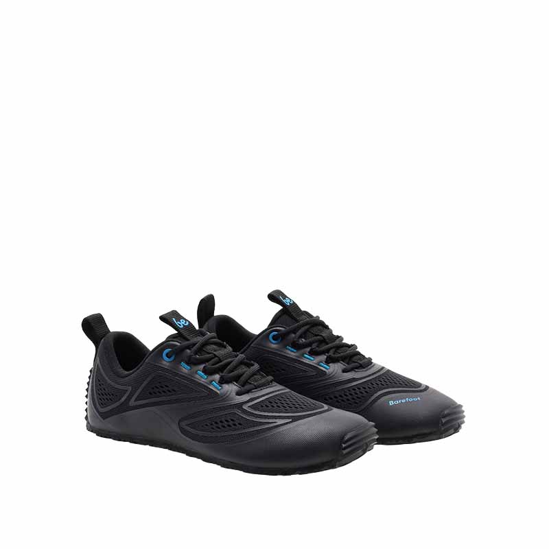Pair of Be Lenka Adults Trailtech Shoes - Black, angled view showing outer side and front.