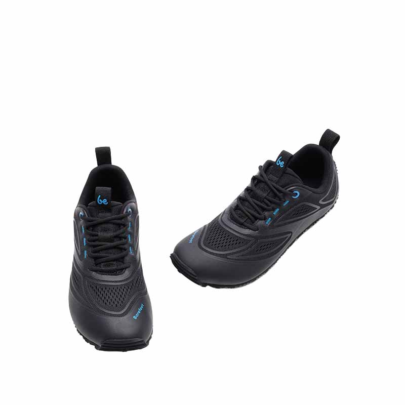 Pair of Be Lenka Adults Trailtech Shoes - Black, angled view showing top and outer side view.