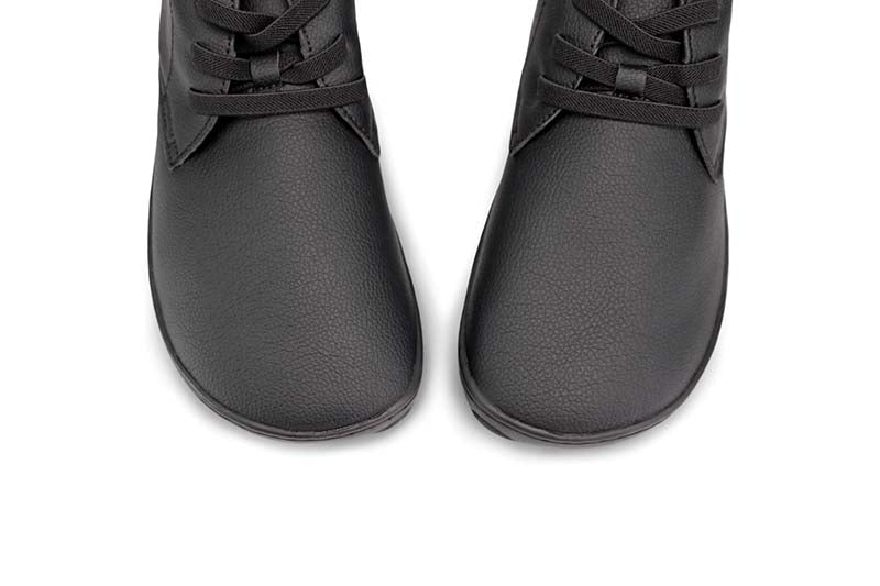 Pair of PaperKrane Kids Vegan Biro School Shoes in black, close up of toe box.