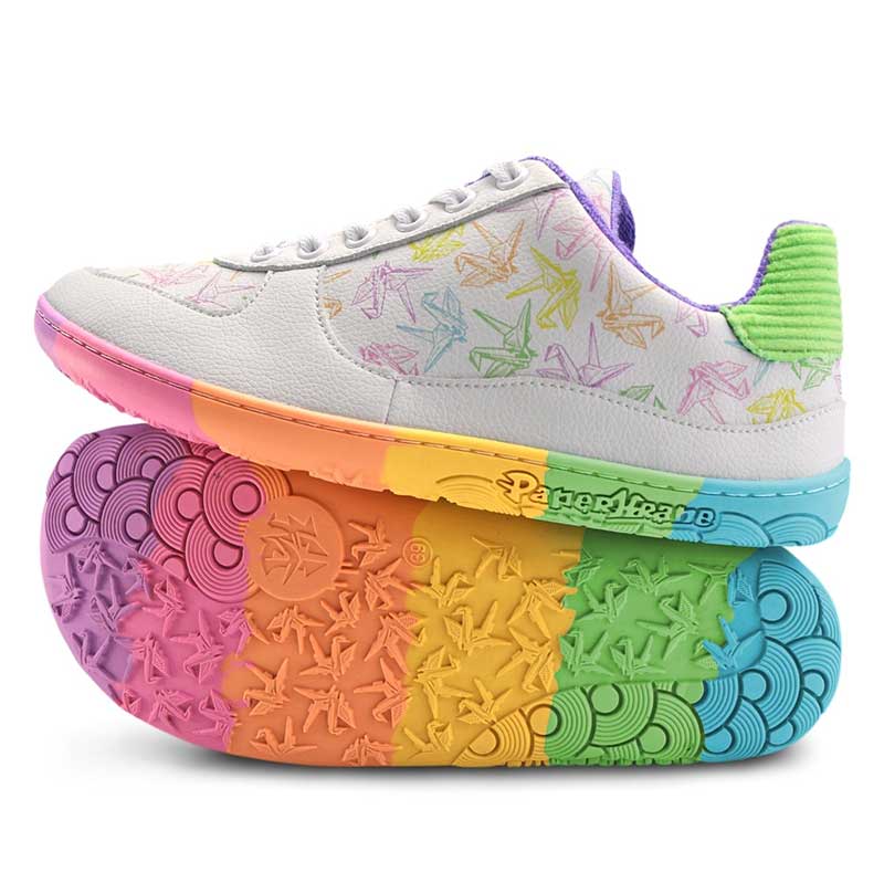Pair of PaperKrane Krane Shoes in white, one showing the outer side , the other on it's side showing the sole.