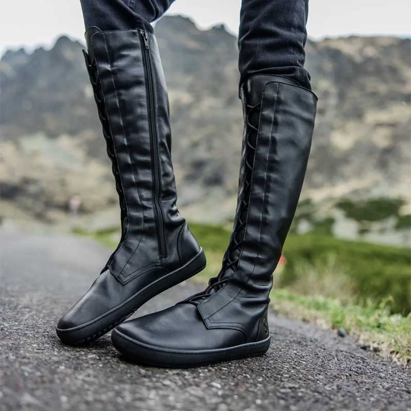 Person wearing Shapen Women's High Lace-Up Boots Abby - Black, inner and outer side view.