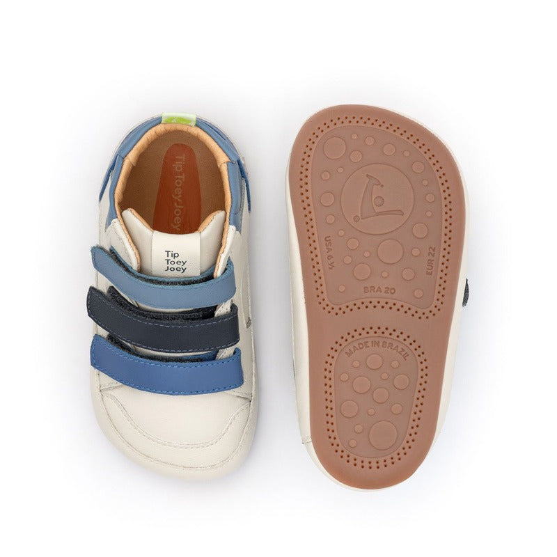 Pair of Tip Toey Joey Toddler Boots Metropoly - Tapioca/Blue Tang/Navy, one showing the top view and the other showing the sole view.