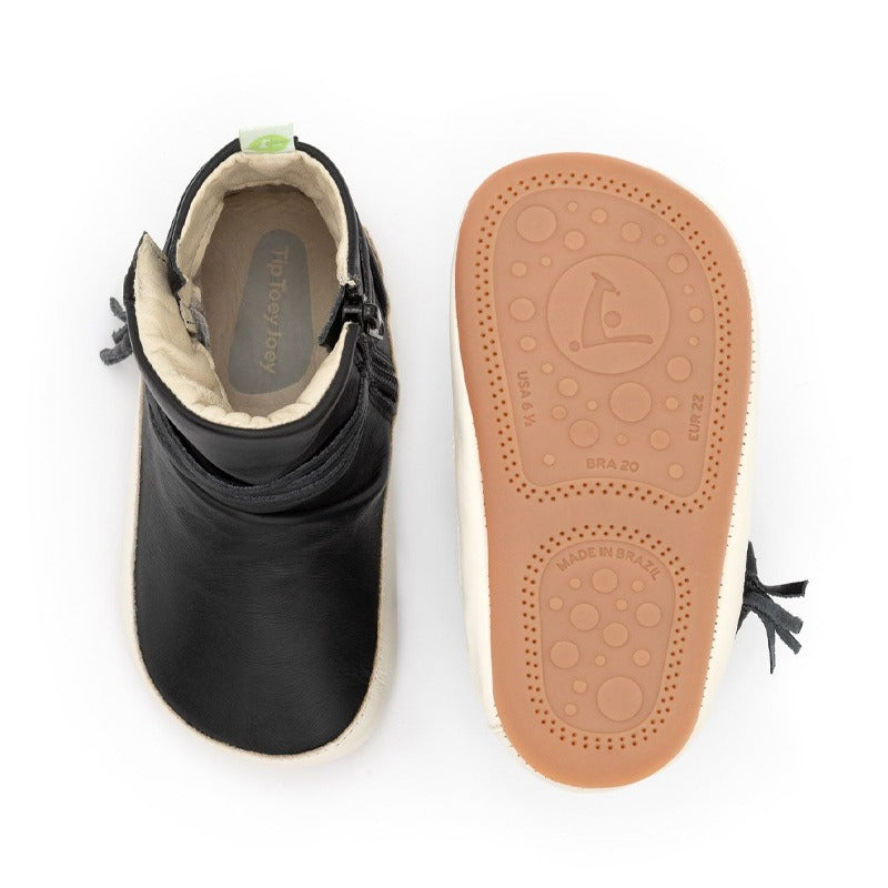 Pair of Tip Toey Joey Toddler Boots Ridgely - Black and Tapioca, one showing the top view and the other showing the sole view.