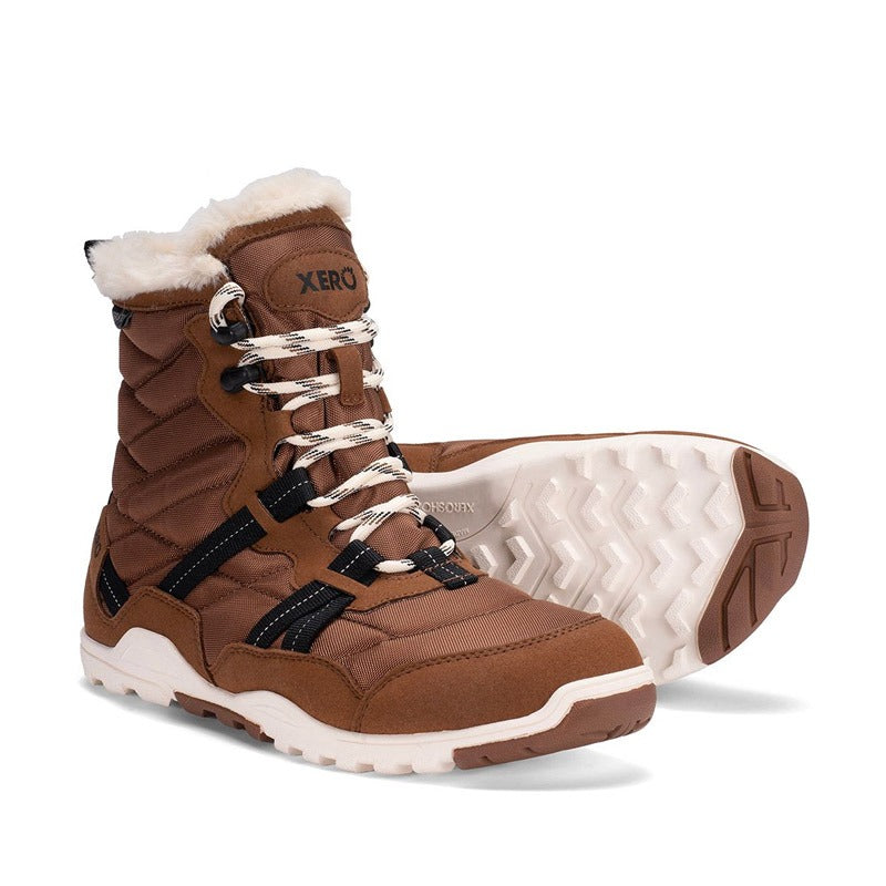Pair of Xero Women's Boots Alpine - Brown, one angled showing the outer side and front view and the other showing the sole view.