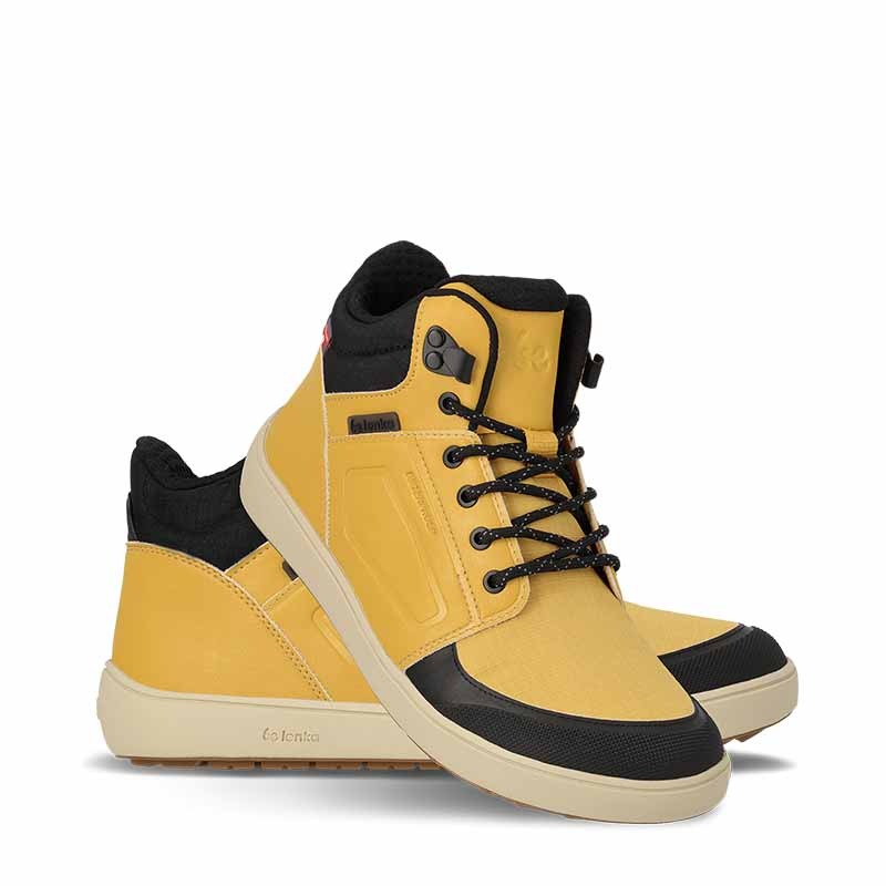 Pair of Be Lenka Adults Boots Arctic Edge - Mustard, one angled and leaning showing the outer side, the other partially showing the inner side