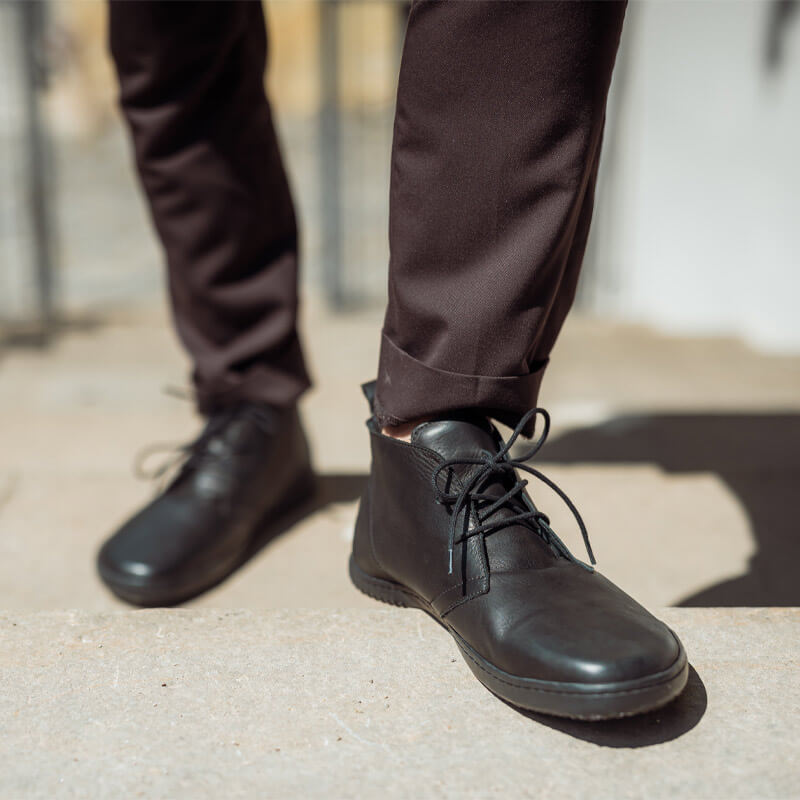 Person wearing Angles Adults Boots Atlas Winter - Black with black trousers