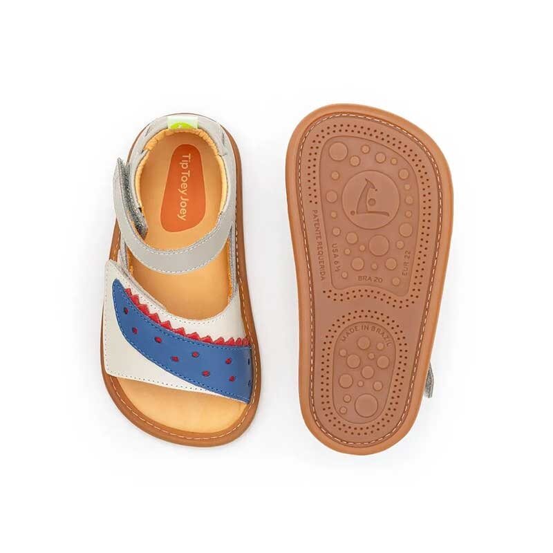 Pair of Tip Toey Joey Toddler Sandals Crunchy - Blue, one showing the top view and the other showing the sole view.