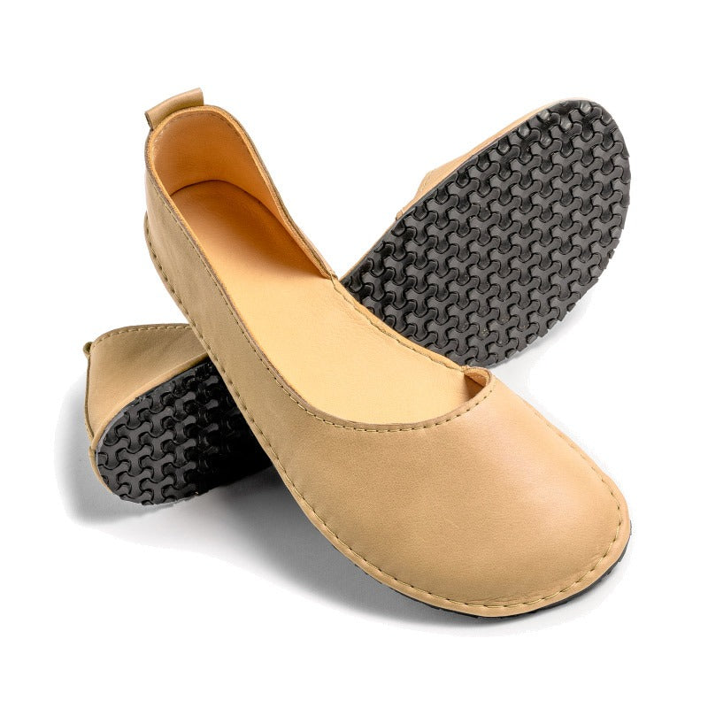 Pair of Luks Ballerina Shoes in beige, top and sole view.