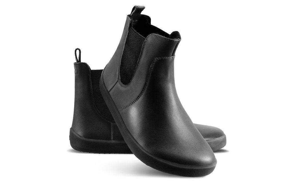 Pair of Be Lenka Adults Boots Entice Neo - Black, one angled and leaning showing the outer side, the other partially showing the inner side