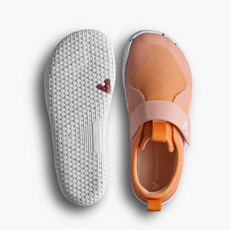 Pair of Vivobarefoot Kids Trainers Primus Sport IV - Apricot, one showing the sole view and the other showing the top view.