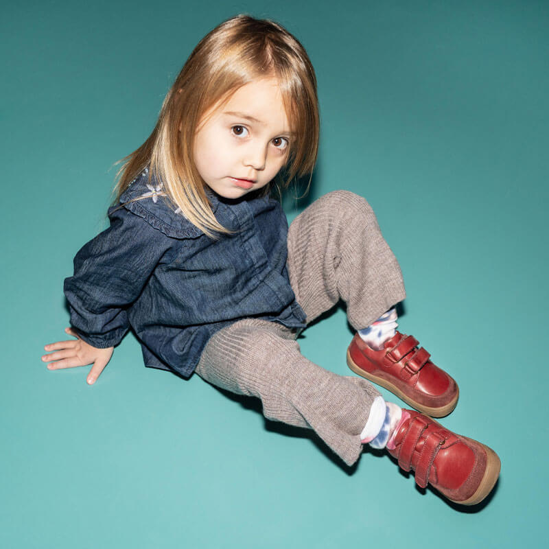 Girl wearing Bundgaard Kids Waterproof Shoes Blaze - Red with denim top and beige trousers