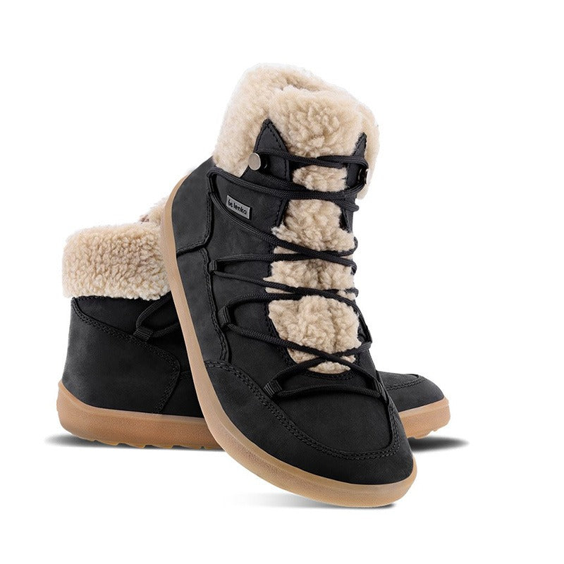 Pair of Be Lenka Adults Boots Bliss - Black, one angled and leaning showing the outer side, the other partially showing the inner side
