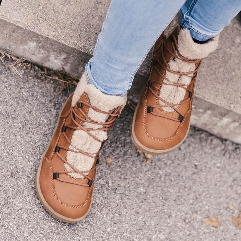 Person wearing Be Lenka Adults Boots Bliss - Brown with blue jeans