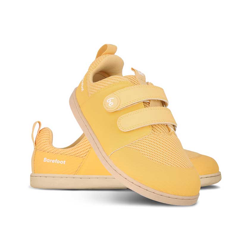 Pair of Be Lenka Kids Trainers Bounty - Yellow, one angled and leaning showing the outer side, the other partially showing the inner side