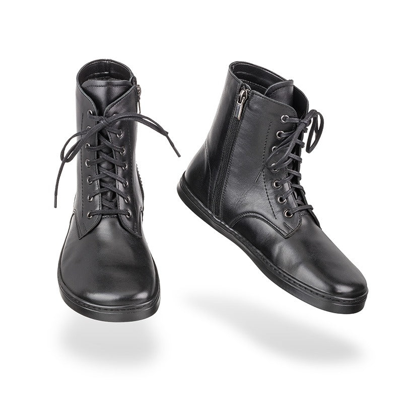 Pair of Peerko Adults Boots Breeze - Black, one showing the front and the other showing the inner side.