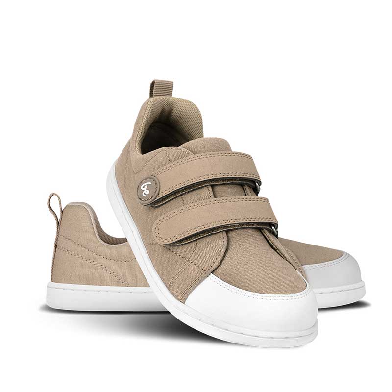 Pair of Be Lenka Kids Trainers Canvi - Light Brown, one angled and leaning showing the outer side, the other partially showing the inner side