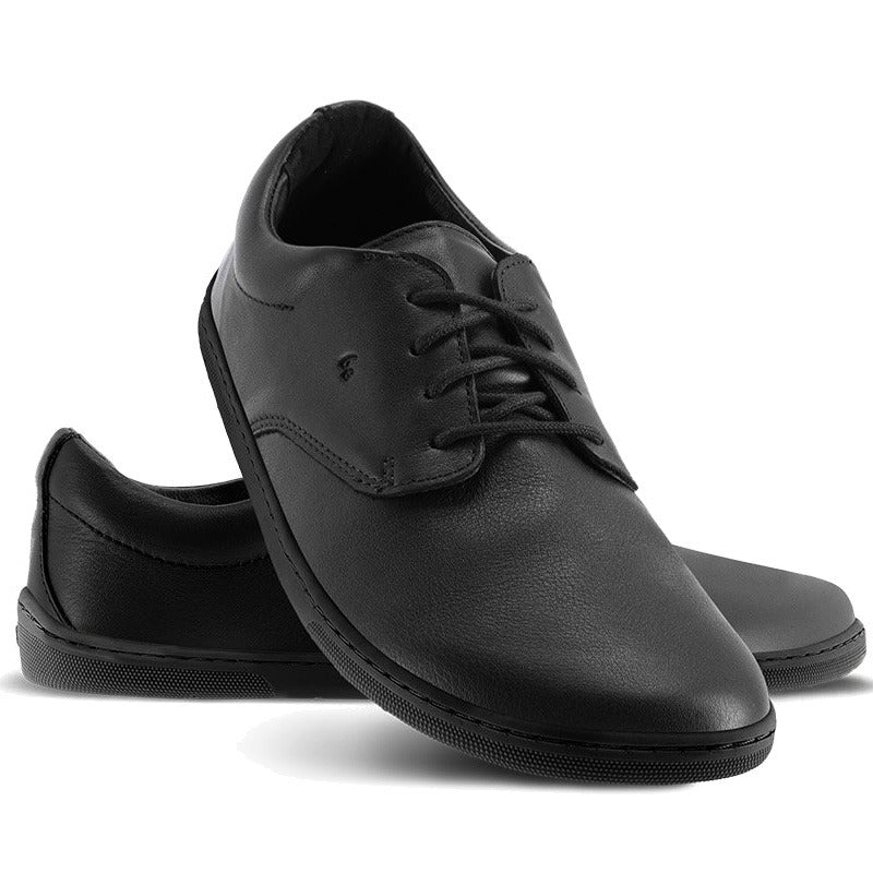 Pair of Be Lenka Adults Shoes Cityscape - Black, one angled and leaning showing the outer side, the other partially showing the inner side 