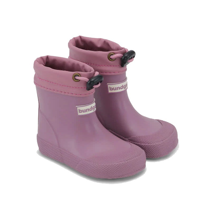 Pair of Bundgaard Toddler Wellies Cover in dark rose, angled view showing outer side and front.
