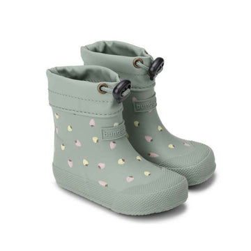 Pair of Bundgaard Toddler Wellies Cover - Strawberries, angled view showing outer side and front.
