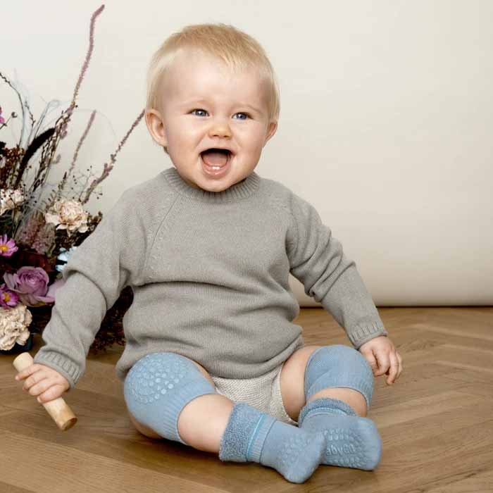 Boy wearing Go Baby Go Crawling Kneepads in dusty blue.