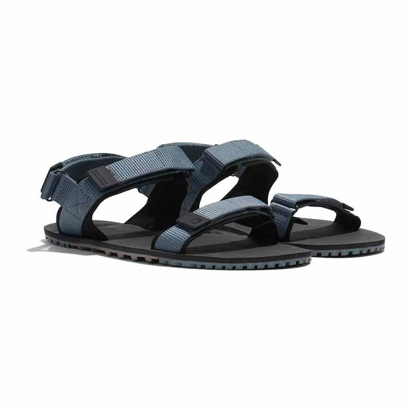 Pair of Xero Men's Sandals D-Trail - Stormy Weather Black, angled view showing outer side and front.