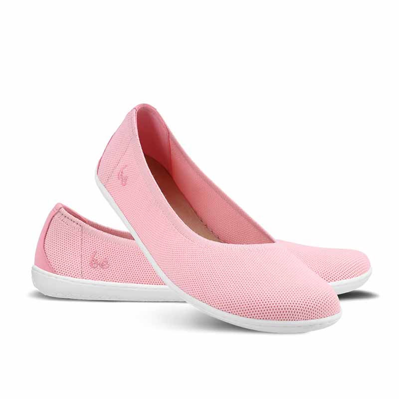 Pair of Be Lenka Women's Ballet Shoes Delight - Light Pink, one angled and leaning showing the outer side, the other partially showing the inner side