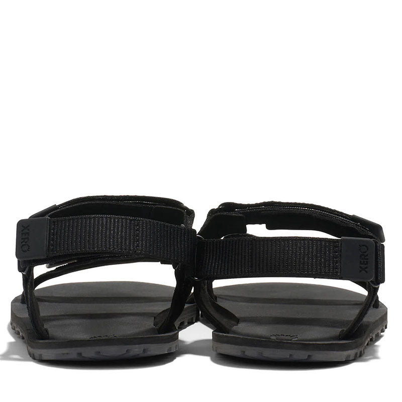 Pair of Xero Women's Sandals D-Trail - Black, rear view.