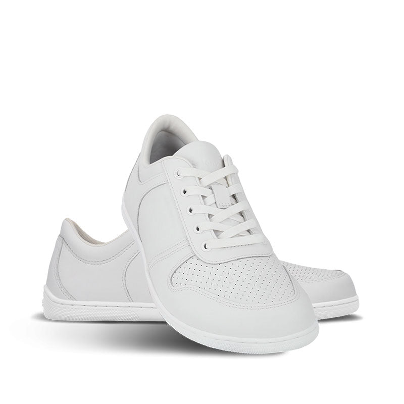 Pair of Be Lenka Adults Trainers Echo - All White, one angled and leaning showing the outer side, the other partially showing the inner side