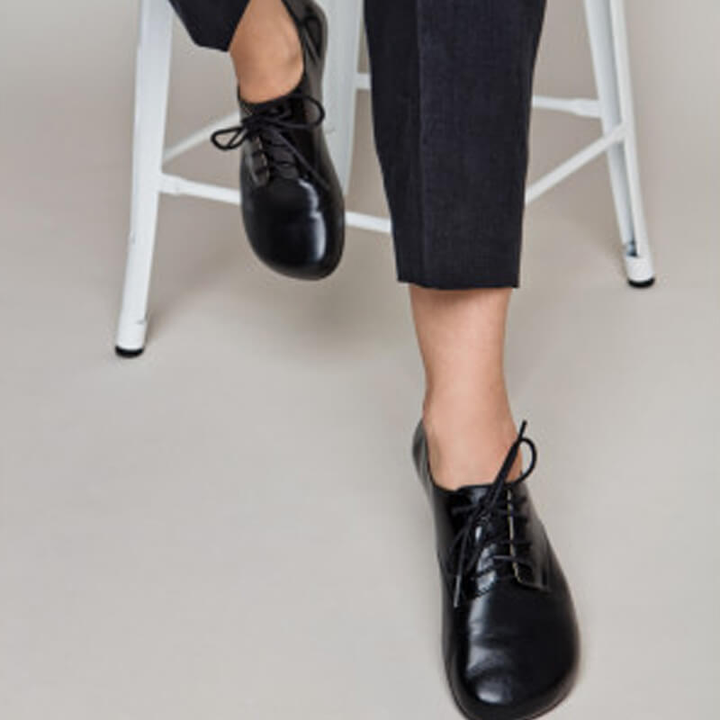 Person wearing Shapen Adults Fleur 2.0 All Year Barefoot Shoes - Black.