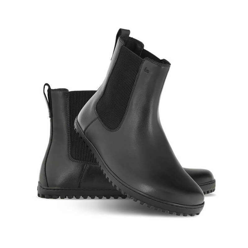 Pair of Be Lenka Adults Boots Glam - Black, one angled and leaning showing the outer side, the other partially showing the inner side