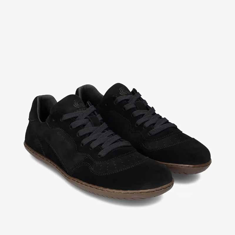 Pair of Groundies Adults Nova GO1 Trainers in black, angled view showing outer side and front.