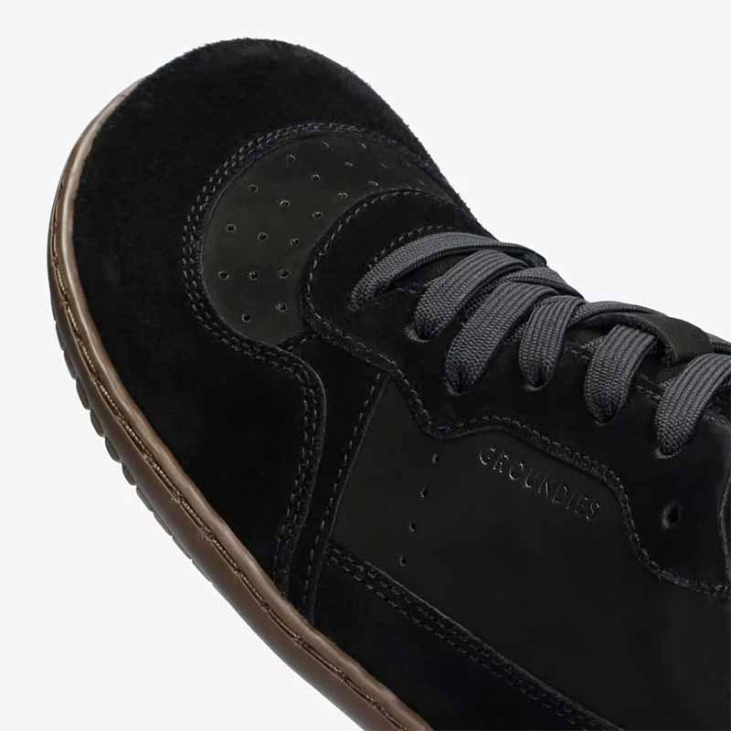 Close up of Groundies Adults Nova GO1+ Trainer in black.