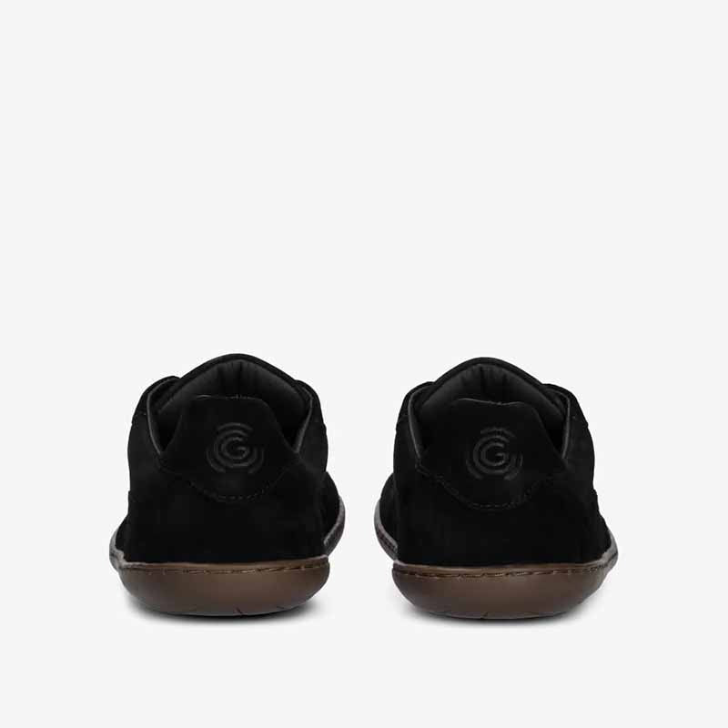 Pair of Groundies Adults Nova GO1+ Trainers in black, rear view.