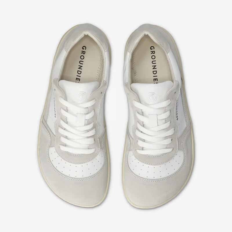 Pair of Groundies Adults Nova GO1+ Trainers - White/Off-White, top view.