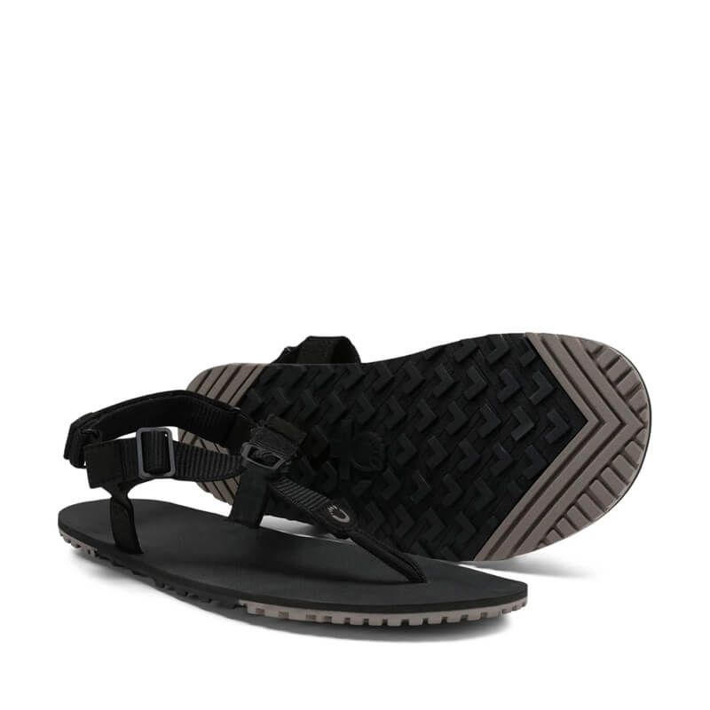 Pair of Xero Women's Sandals H-Trail - Black, one angled showing the outer side and front view and the other showing the sole view.
