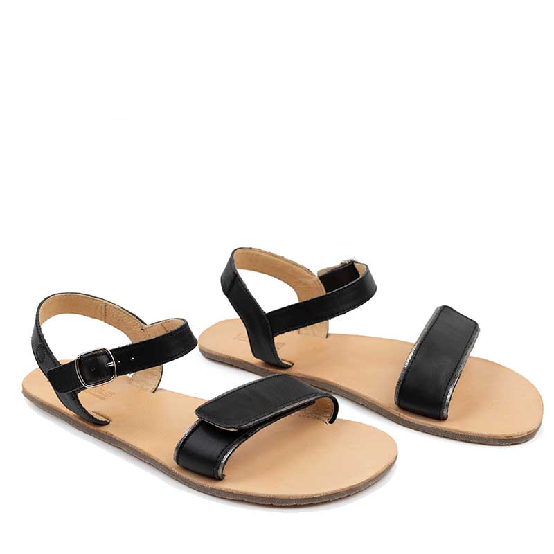 Pair of Tikki Women's Sandals Hera - Black, angled view showing outer side and front.