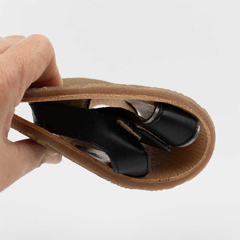 Tikki Women's Sandal Hera - Black, folded up.