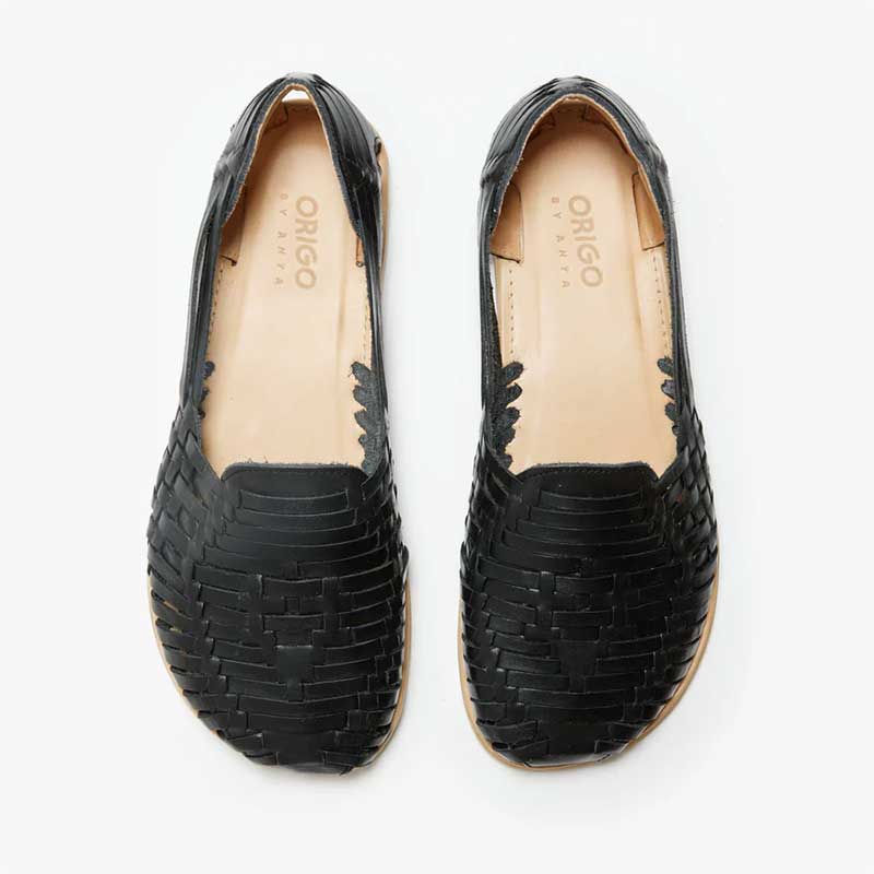 Pair of Origo Women's Huarache Slip-On Wide Sandals By Anya in black, top view.